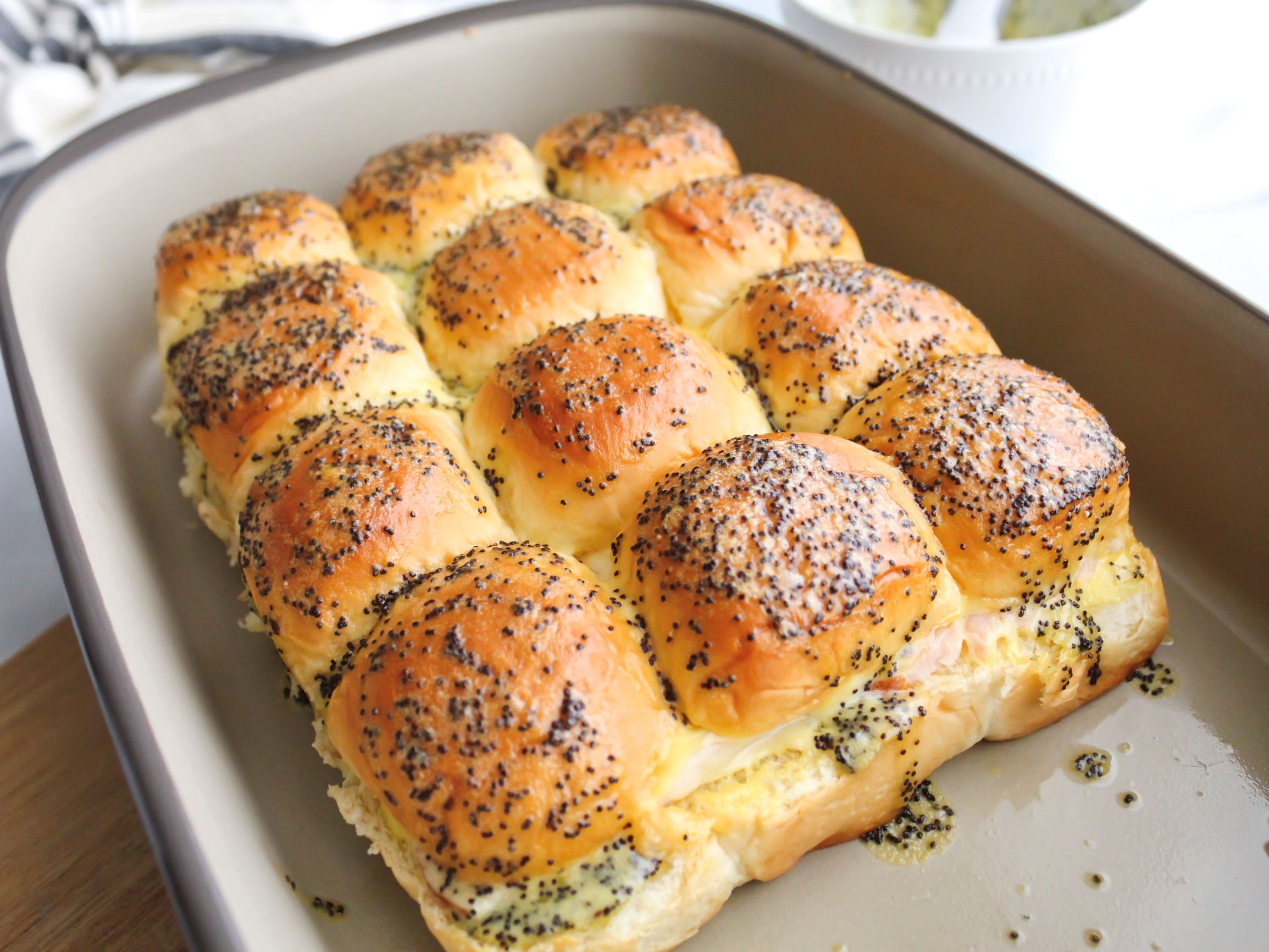 Baking pan of turkey and provolone sliders