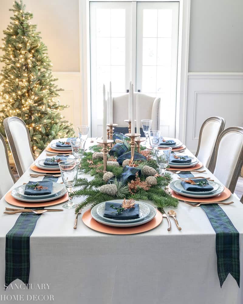 Christmas tablescape decorating ideas using blue, green, copper, and tartan plaid accents