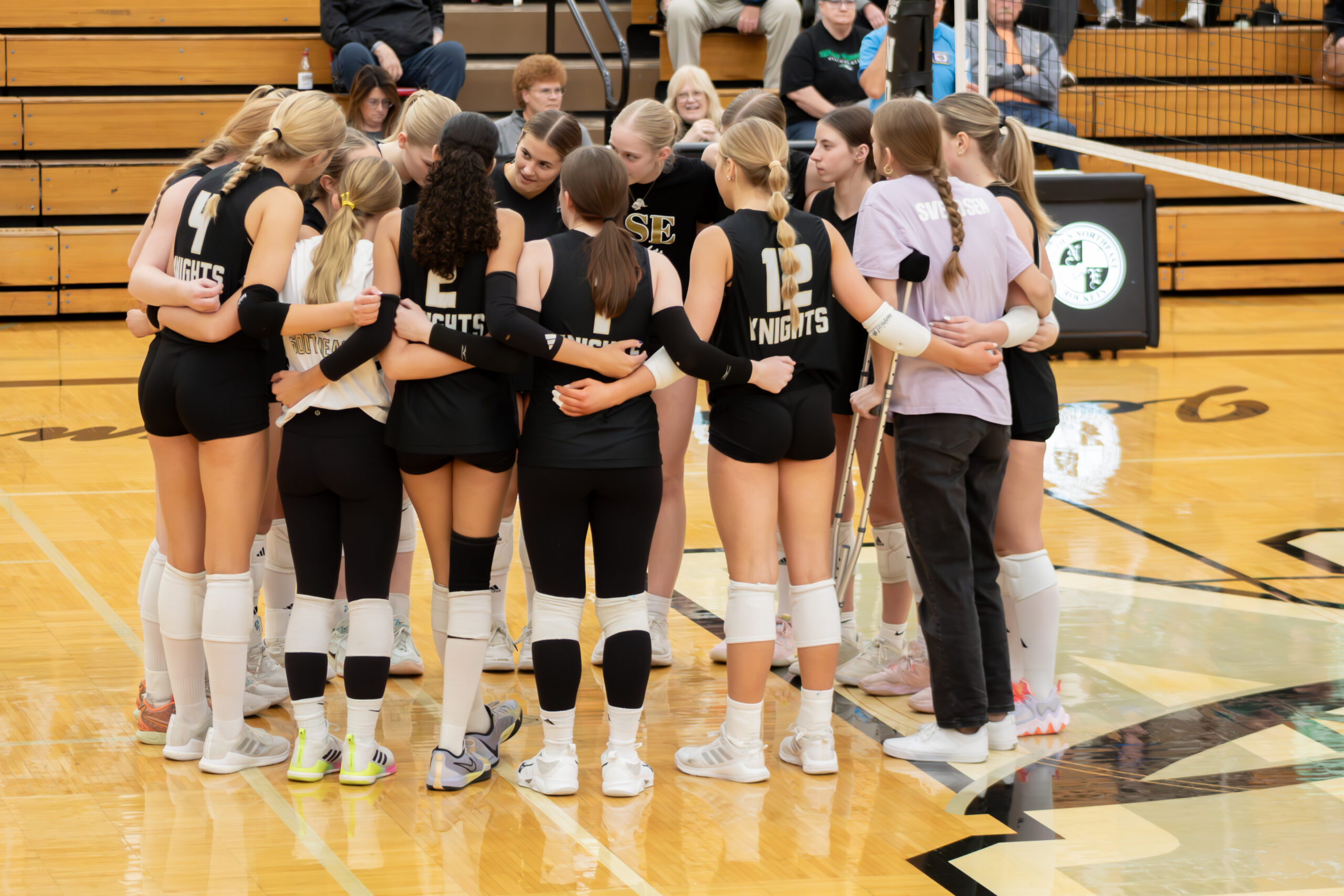 Volleyball team huddle