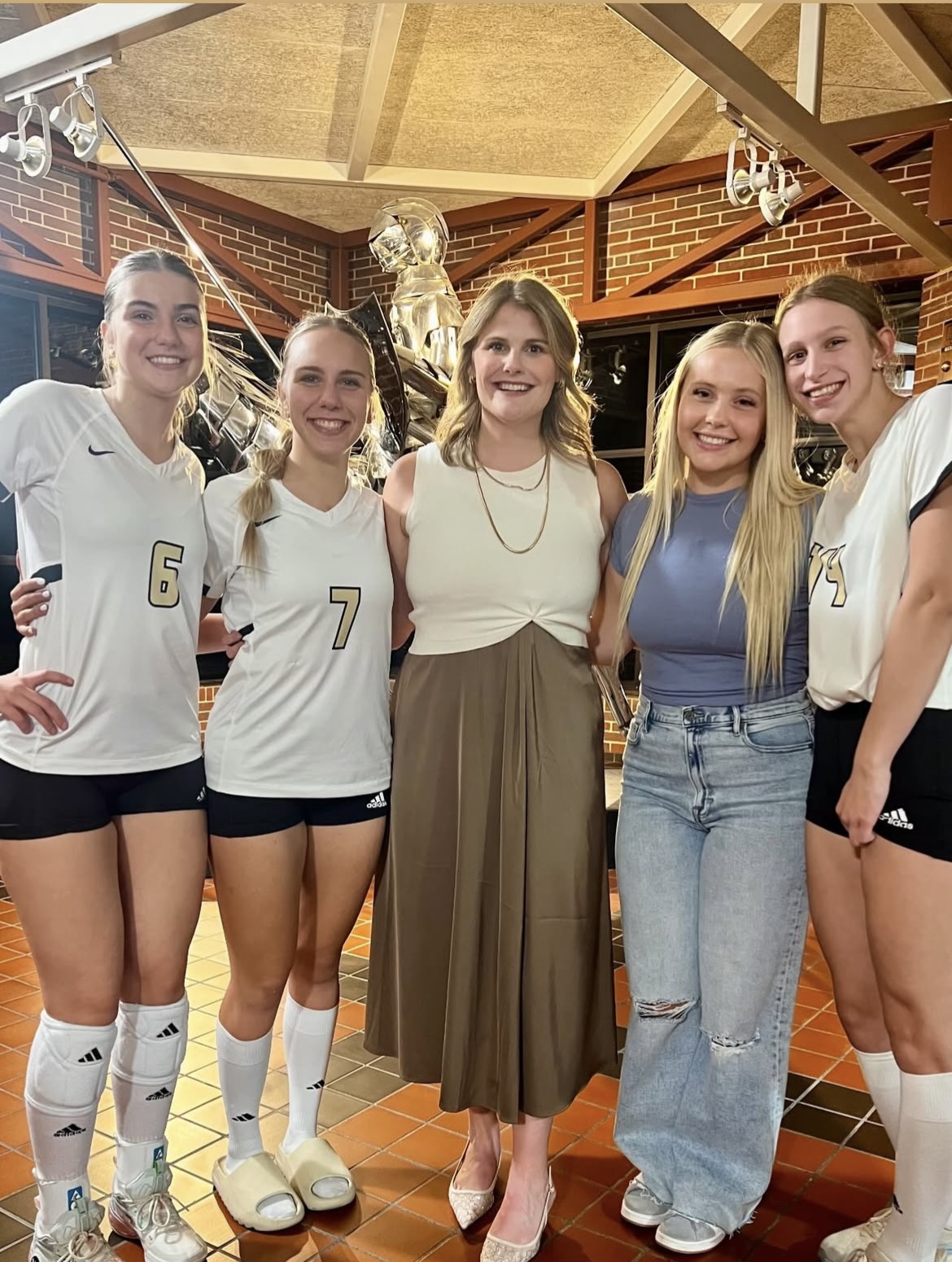 senior vollebyaol players with their head coach