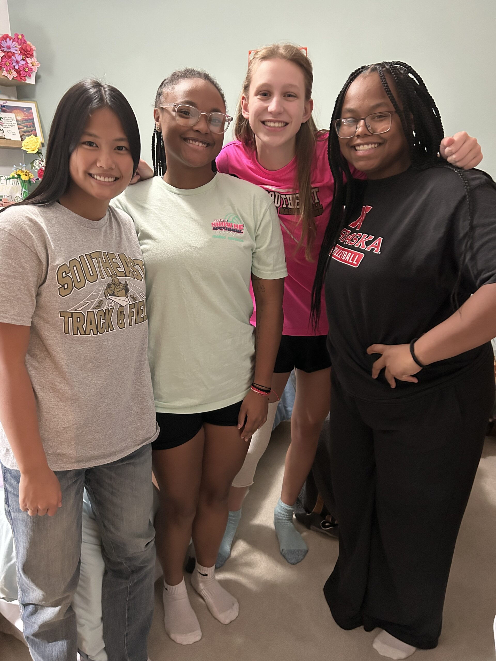 girl smiling with friends visiting her after surgery