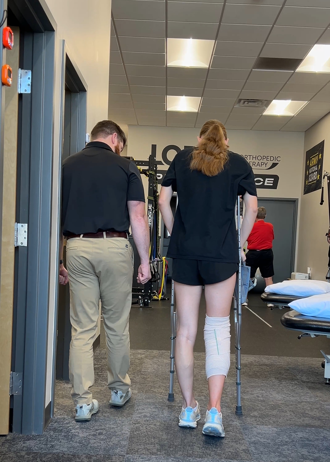 girl on crutchces doing pnysical therapy