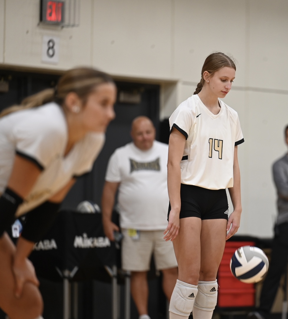 volleyball player getting ready to serve
