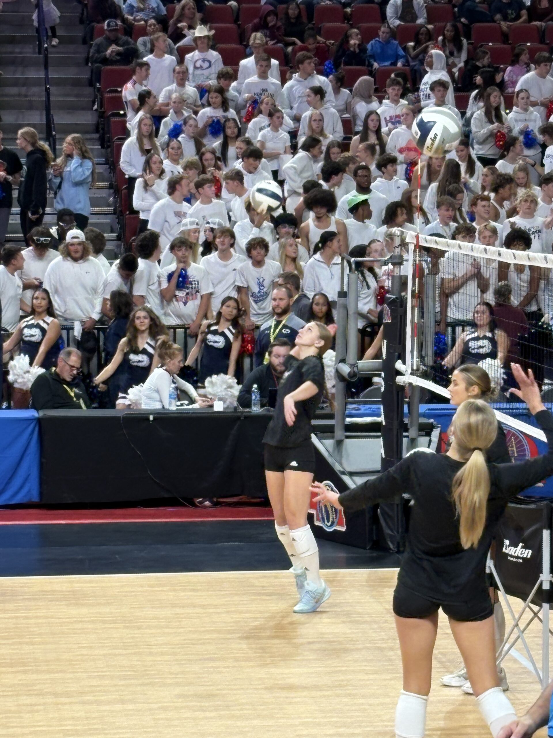 volleyball player on the court hitting the ball during warm ups
