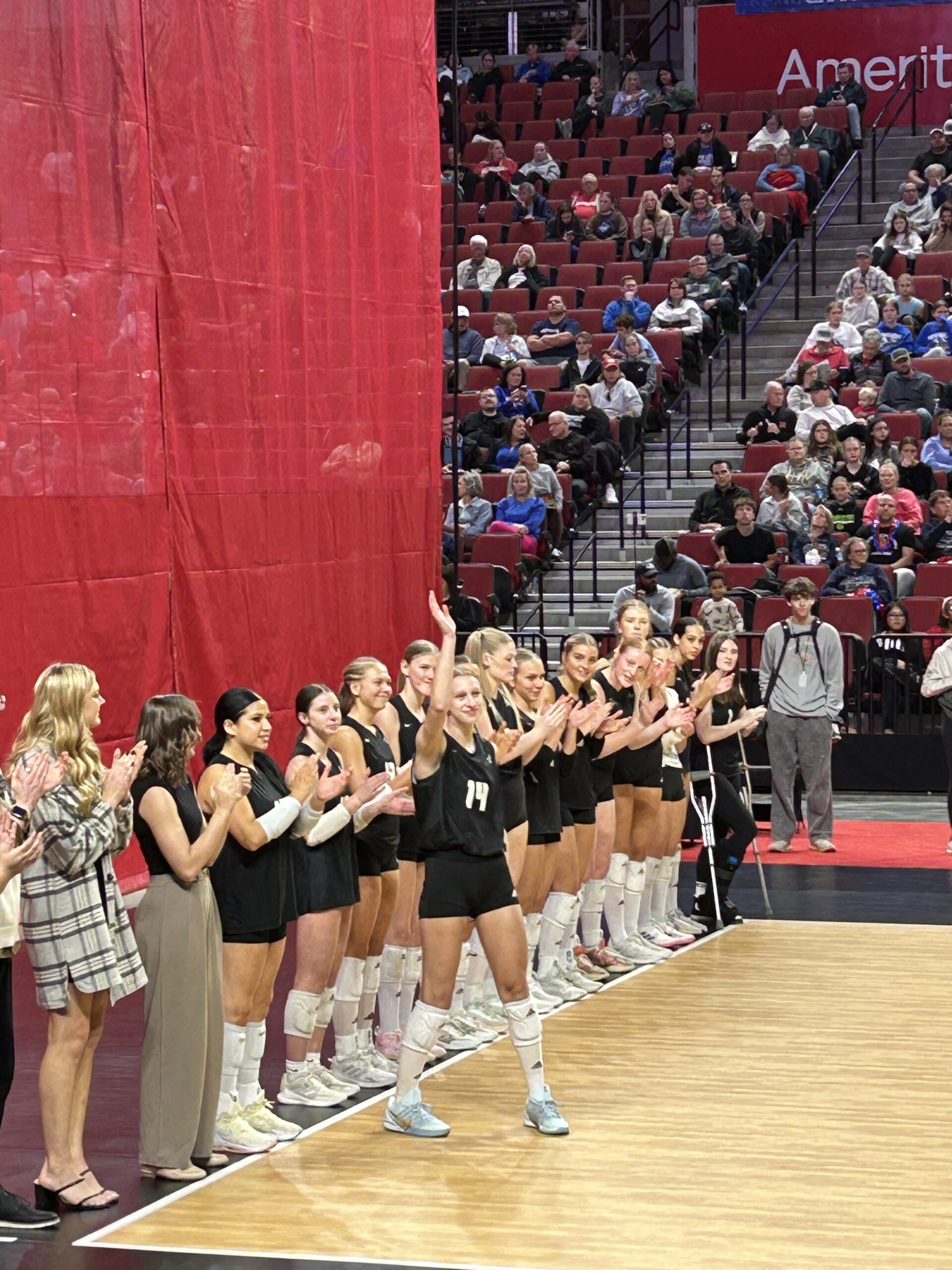 players being introduced and waving during the state volleyball tournament
