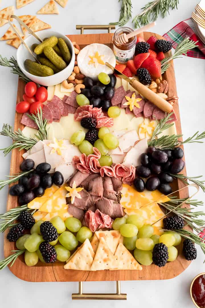 Fareway grocery bag with pre-made meat and cheese tray, crackers, and produce to make a Christmas charcuterie board