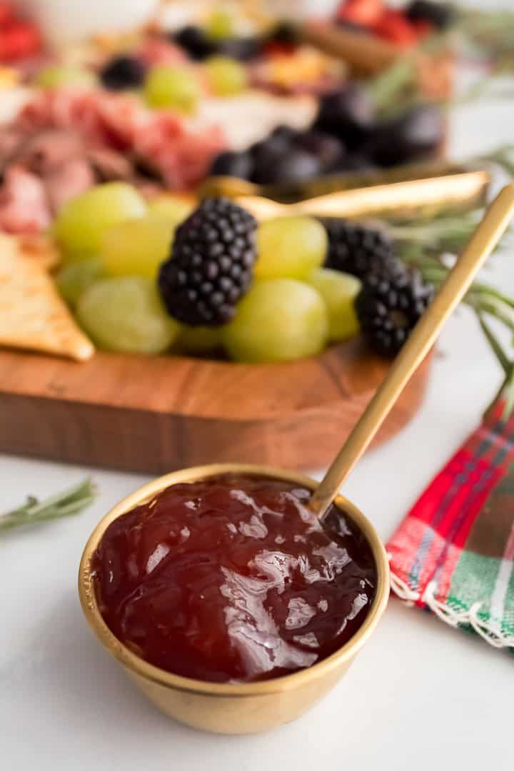 Small gold bowl with strawberry jelly for a charcuterie board