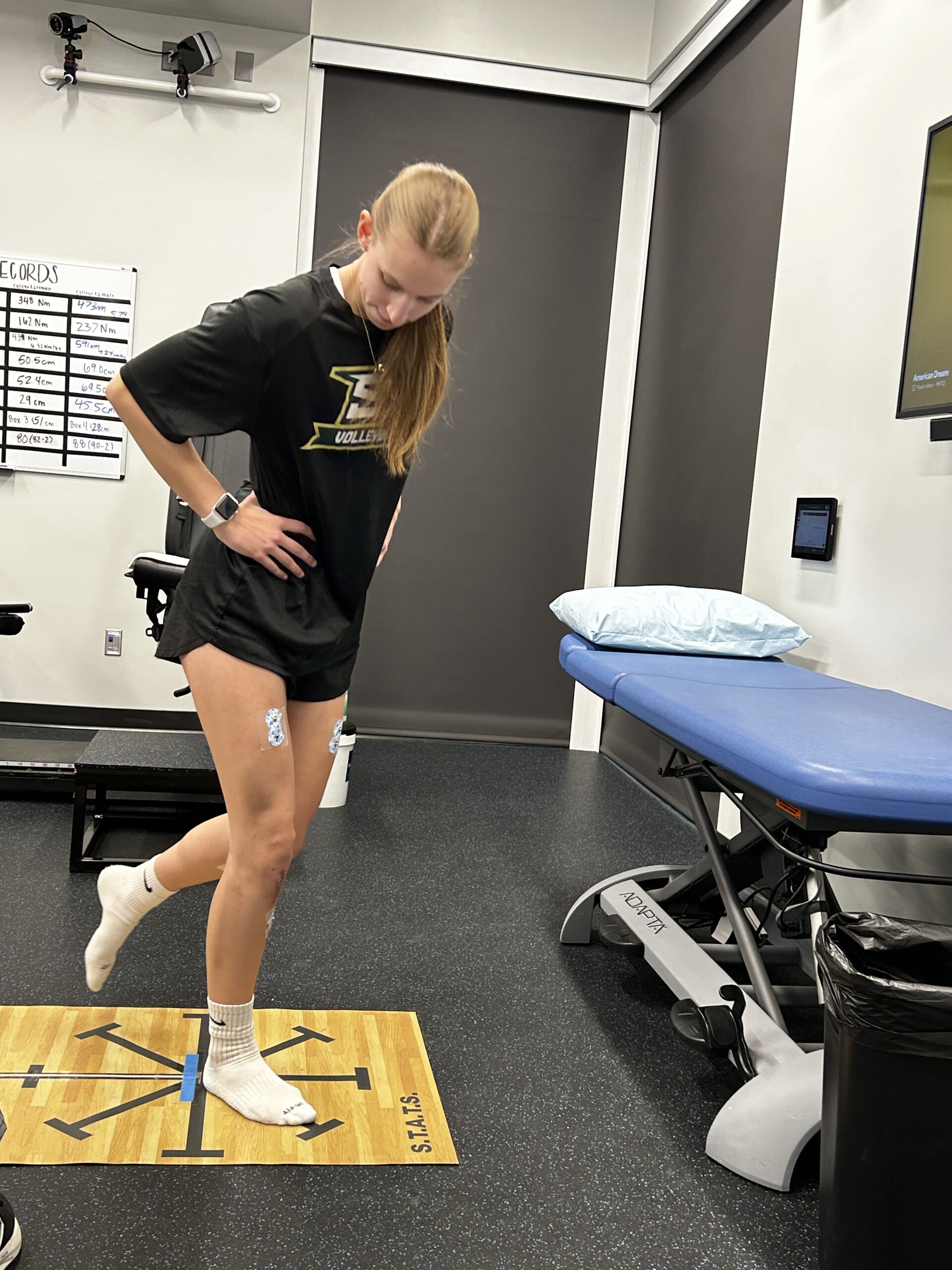 Volleyball athlete doing blanace testing during ACL recovery