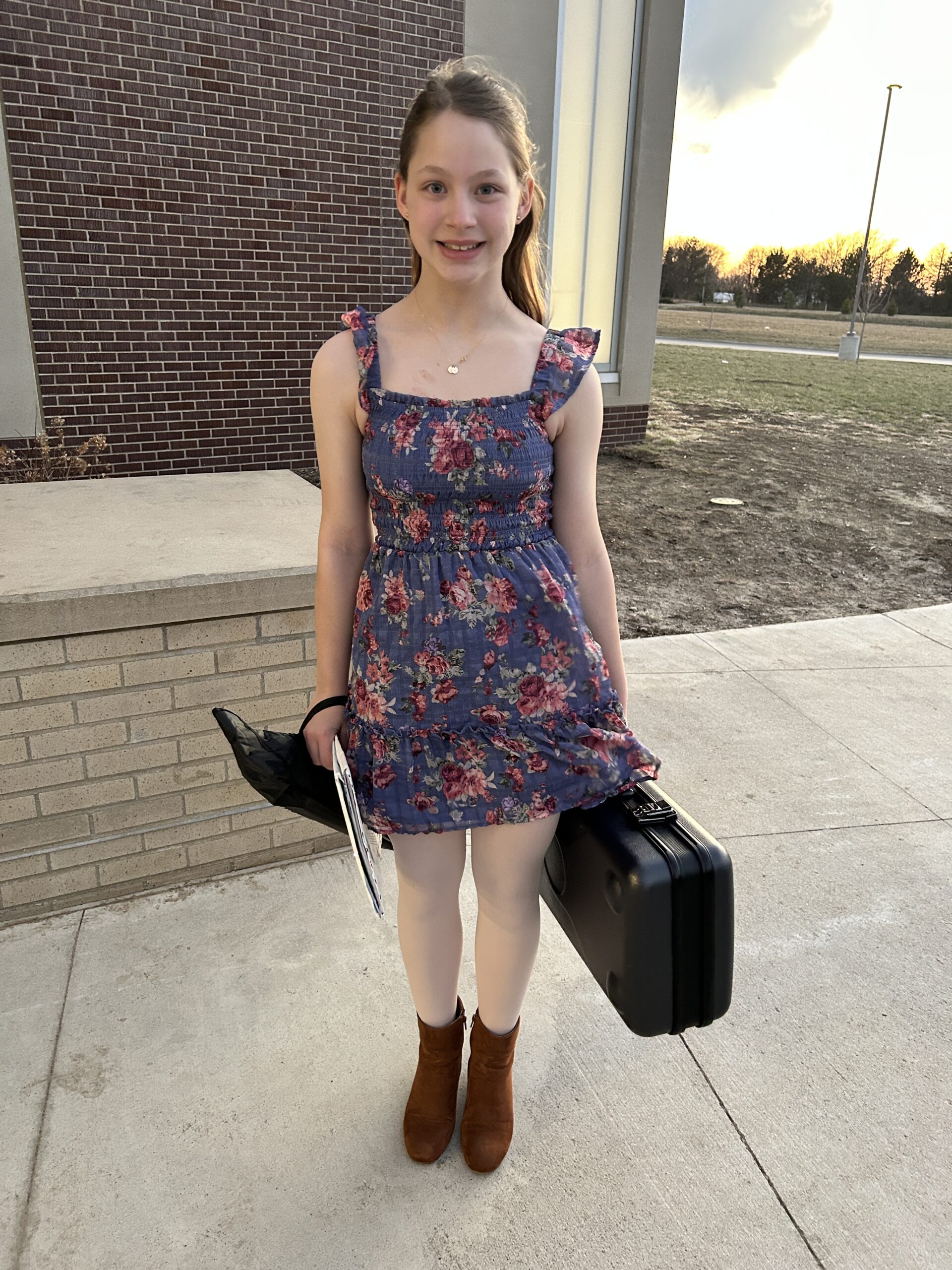 Band member standing and smiling after a concert