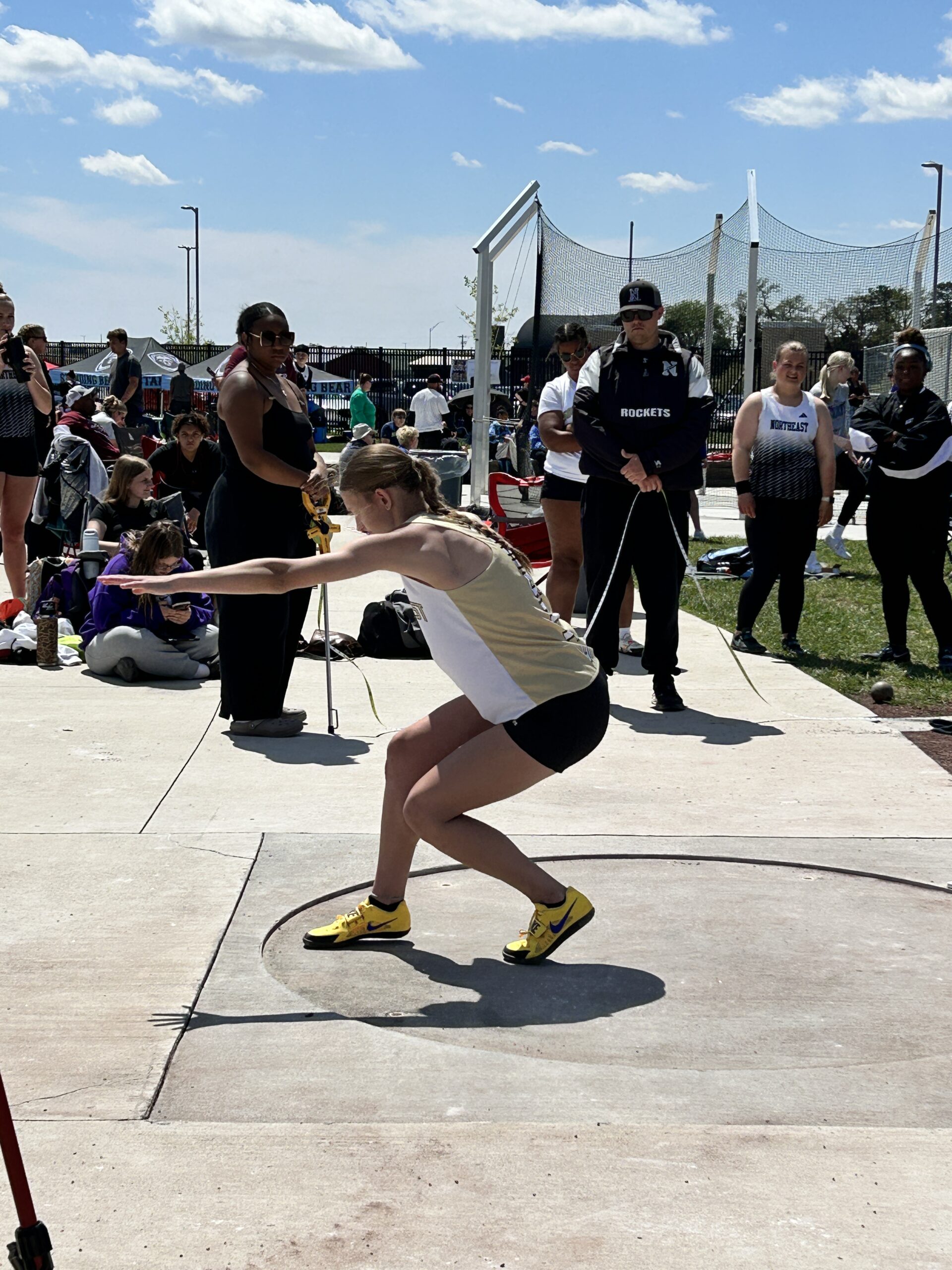 Athlete throwing the shot put