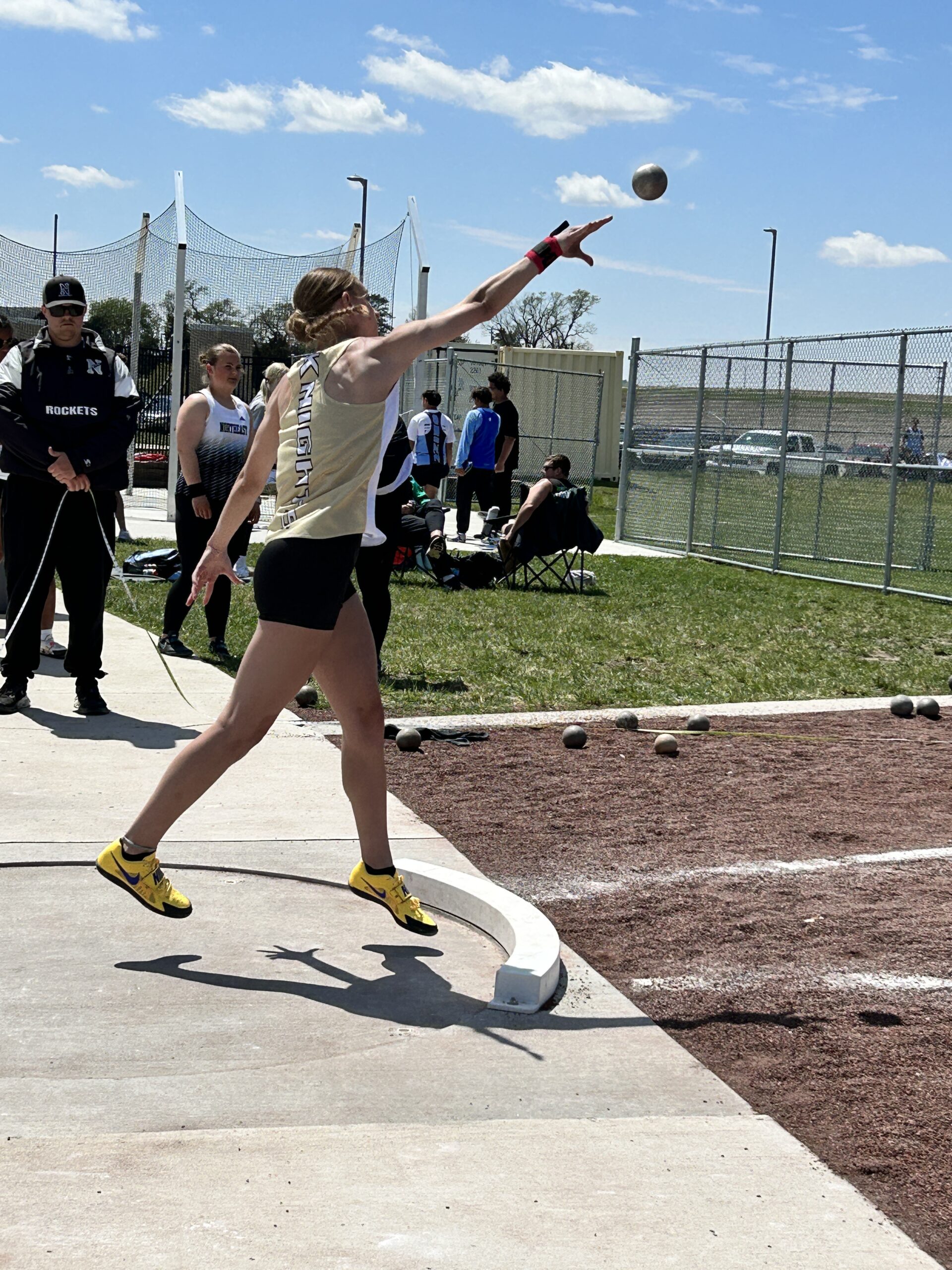 Athlete throwing the shot put