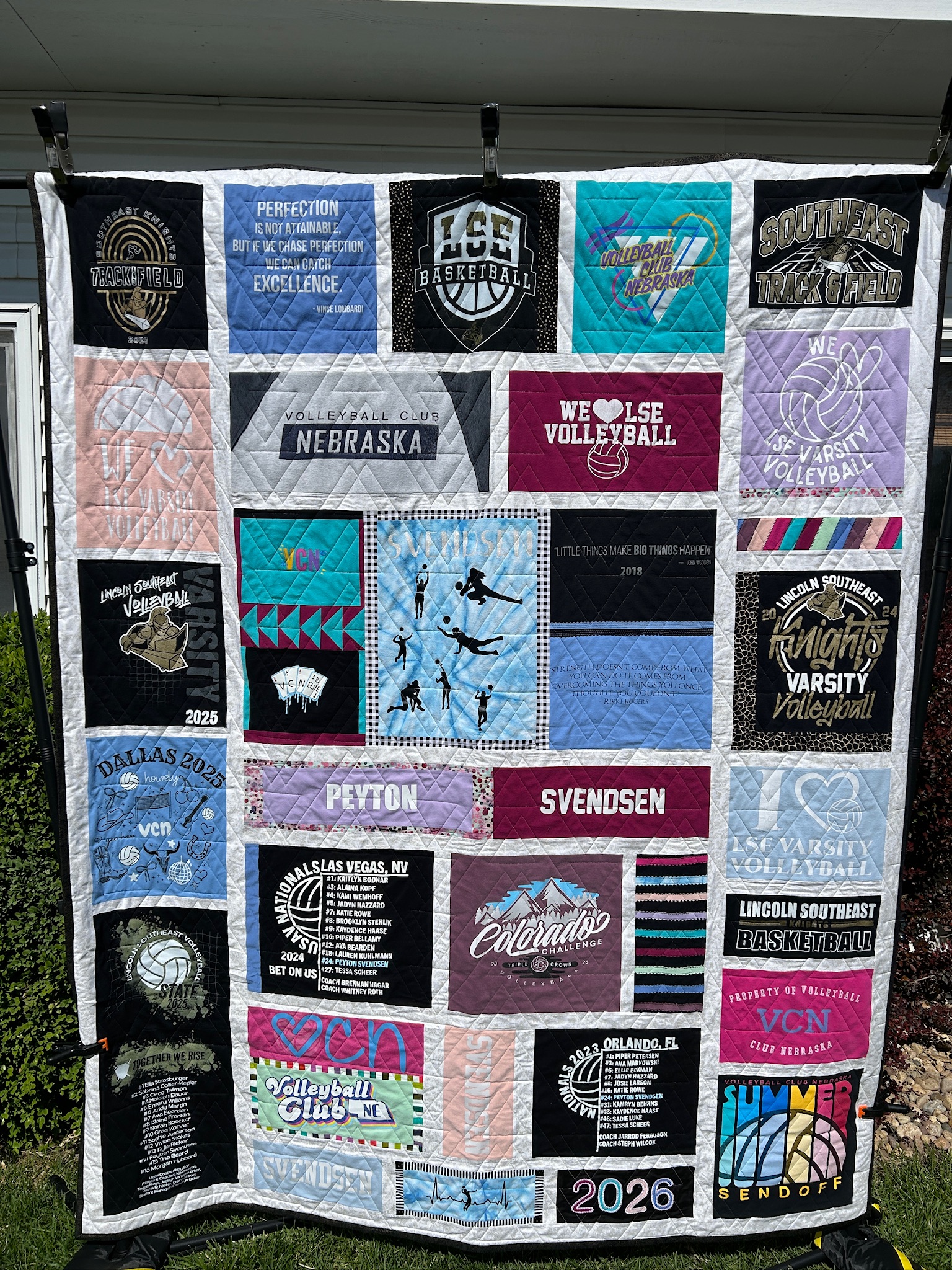Custom t-shirt quilt hug from a backdrp and displayed at the graduation party