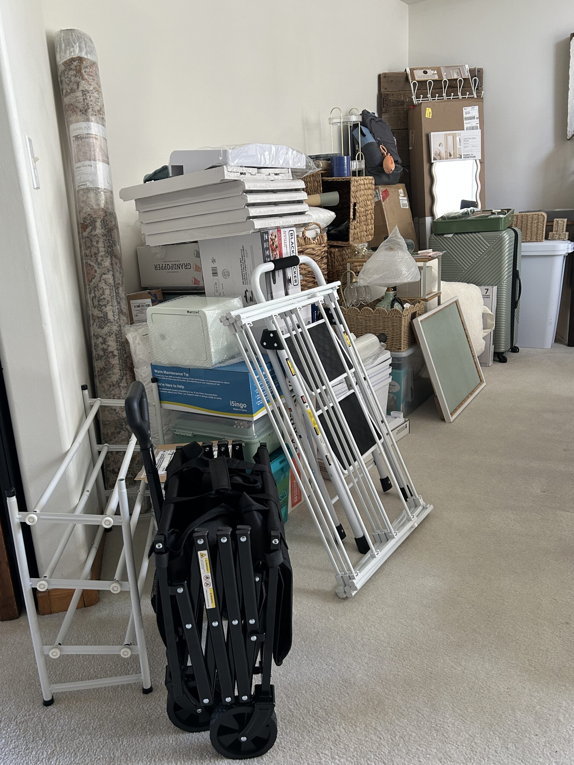 College dorm room supplies and decor stacked in the dining room before move-in day.