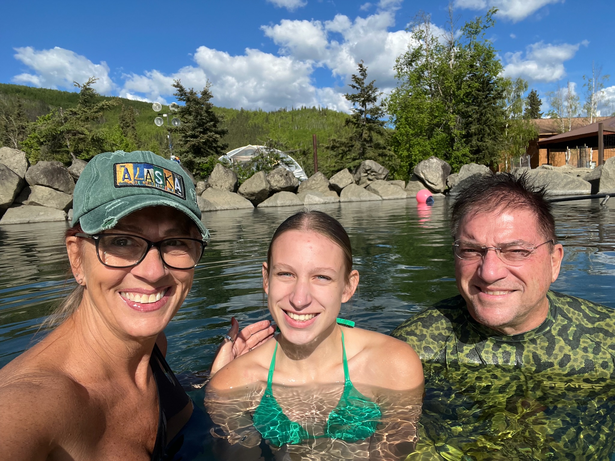 Tourists soaking in the Cheyna Hot Springs in Alaska
