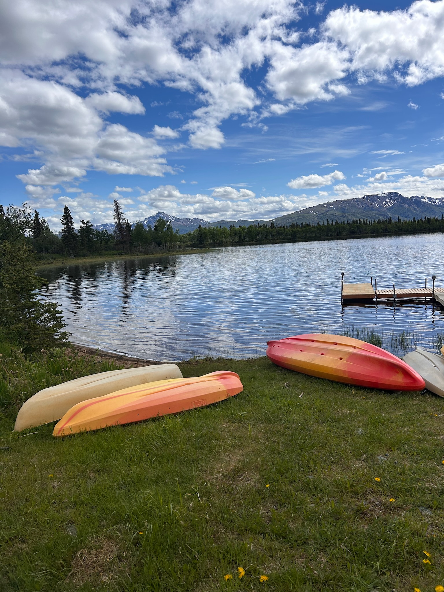 Views of Mt. Denali in Alaska and a lake with kayaks