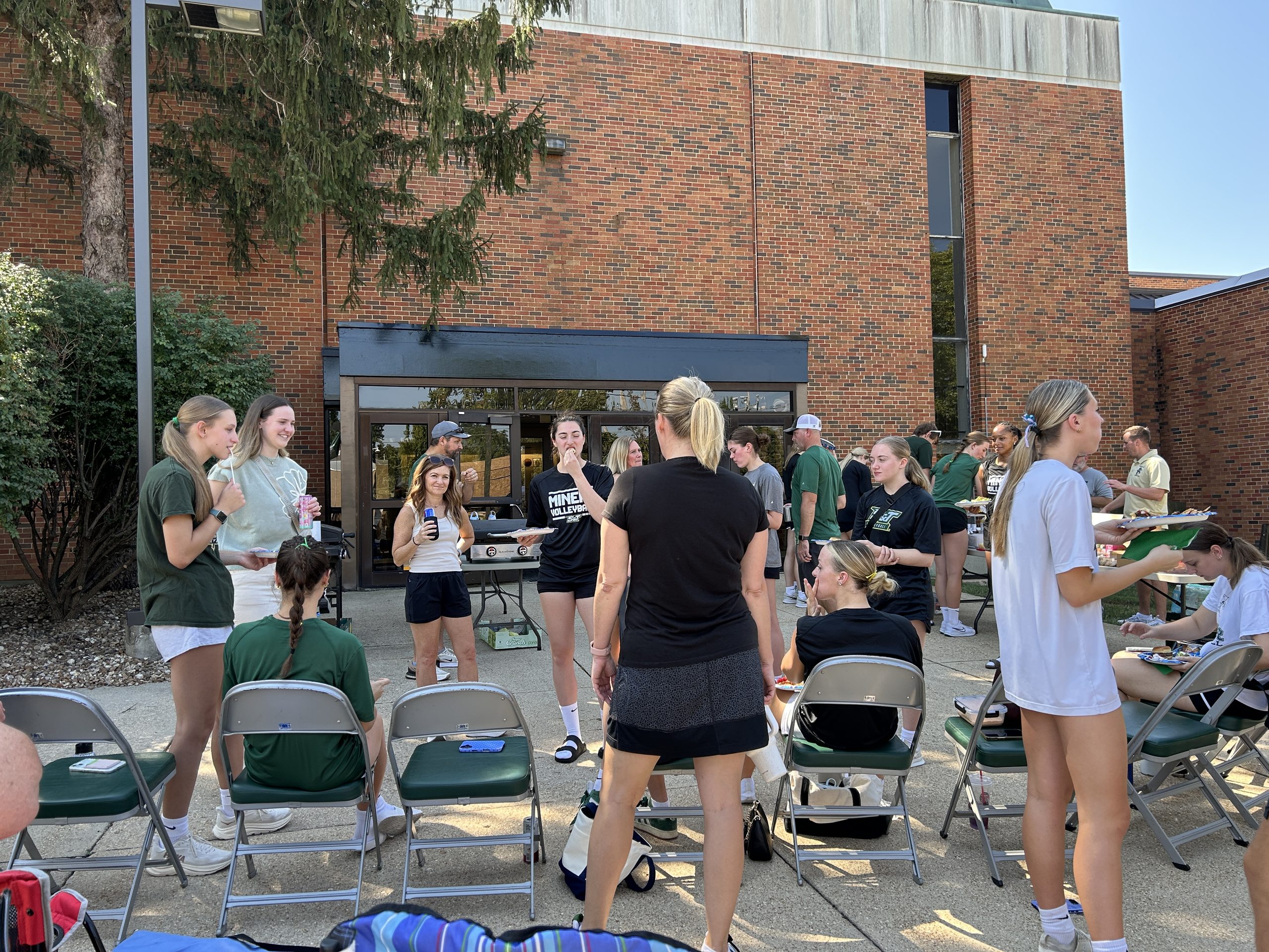 Missouri S&T volleyball players, families, and friends gathered outside for a team tailgate before a home match.