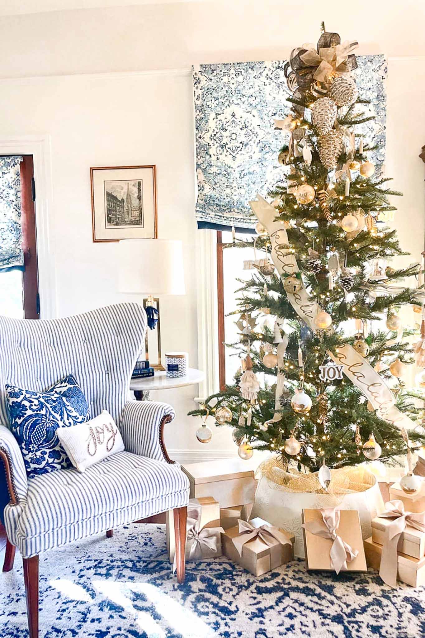 Gold and white holiday color palette on a Christmas tree decorated with gold and white ornaments, ribbon, and coordinating wrapped gifts.